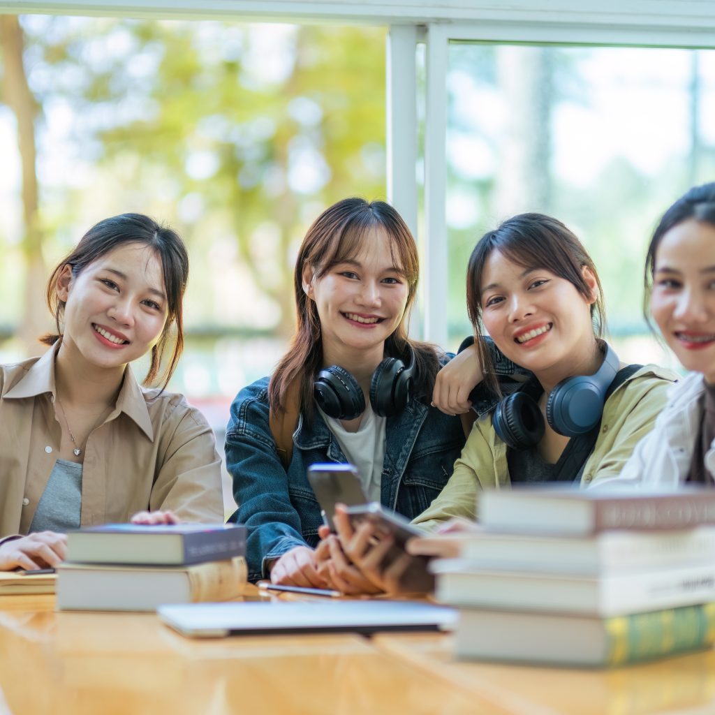 Group of JC students studying together and staying motivated through JC economics tuition, building understanding and exam confidence