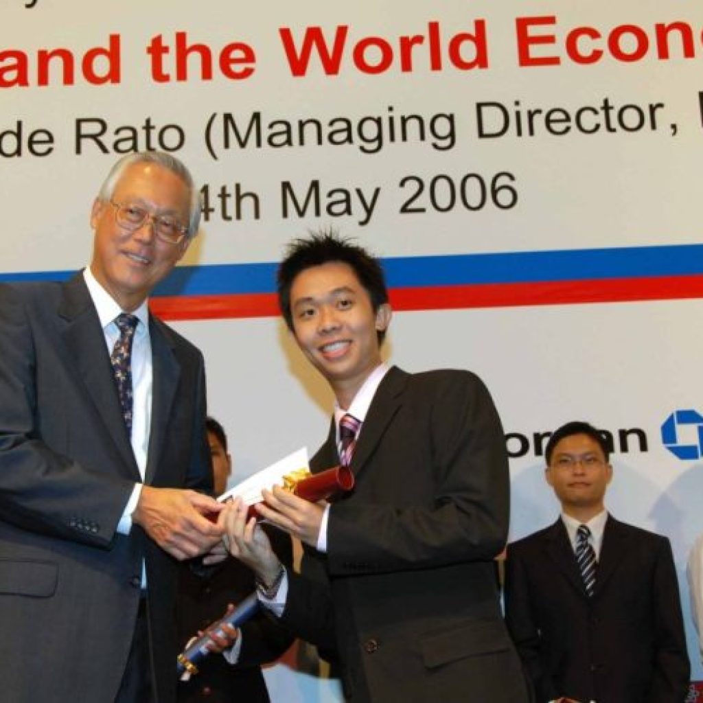 Melvin Koh, one of the prominent tutors at a top economics tuition centre, receiving an award